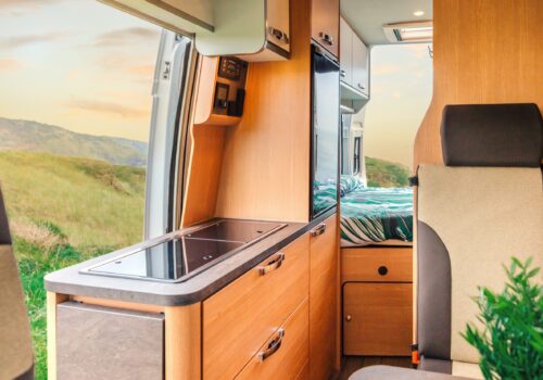 Interior,Of,A,Camper,Van,With,Kitchen,And,Bed,In