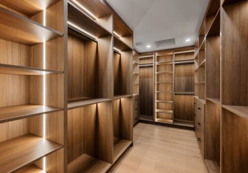 Spacious,Walk-in,Closet,Featuring,Sleek,Custom,Wood,Shelving,,Built-in,Lighting,